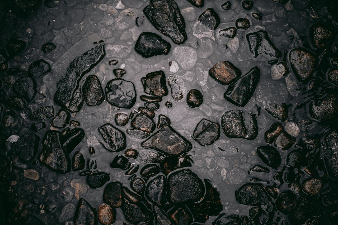 Dark polished stone with soft reflections